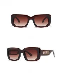 Retro square sunglasses with brown gradient lenses and pink floral pattern on the temples