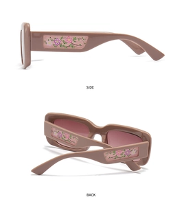 Detail view of square sunglasses with floral patterns on side and back temples
