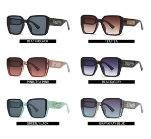 Detail view of square oversized sunglasses collection with unique butterfly pattern on temples