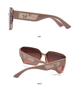 Detail of square sunglasses with gradient brown lenses and floral painted temples