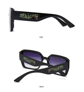 Detail view of side and back frames on square sunglasses with colorful floral temples