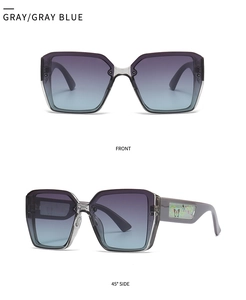 Detail of square oversized sunglasses with gradient lenses and colorful butterfly motif