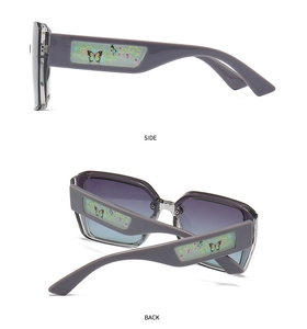 Side view of square purple sunglasses with floral butterfly pattern on temple tips