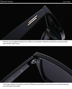 Détail de lunettes de soleil œil-de-chat noires avec accents dorés et charnières