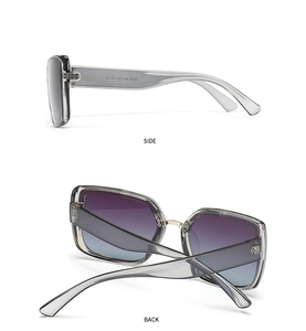 Detail view of square oversized sunglasses showing silver metal hinges and CE markings