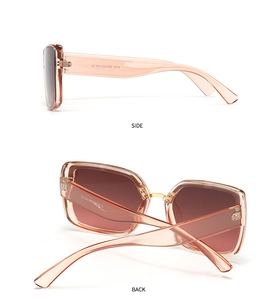 Detail view of pink square oversized sunglasses showing temple specs and back profile