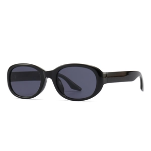 Retro black oval sunglasses with polished frames and dark gray lenses for modern women