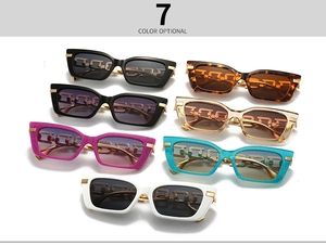 Flat lay of vintage cat-eye sunglasses in 7 colors with golden chain temples