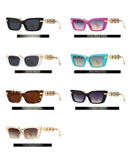 Flat lay of modern cat-eye sunglasses collection with luxury gold metal chain temples