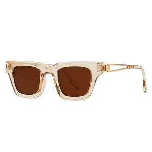 Lunettes de soleil carrées avec monture champagne et branches en métal doré ajouré