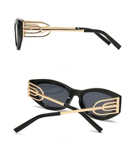 Detailed side view of cat eye sunglasses with golden hollow geometric metal temples
