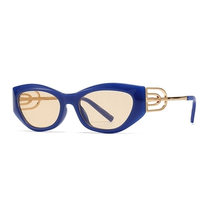 Retro cat-eye sunglasses with blue frames and gold metal temples featuring ring details