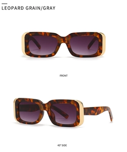 Detail of leopard print sunglasses with purple gradient lenses and gold metal trim