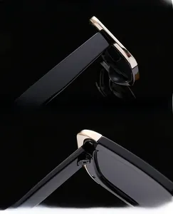 Detail of cat eye sunglasses showing UV protection lenses and reinforced gold metal hinges