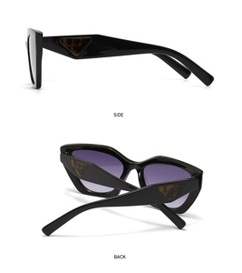 Detail of retro square black sunglasses with purple gradient lenses and side triangle accent