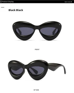 Close-up of avant-garde oversized black sunglasses showing front and side profile views