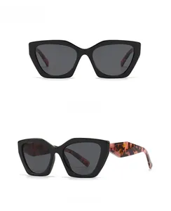 Detail view of retro square sunglasses featuring tortoiseshell temples and metal triangles