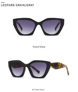 Close-up of cat-eye sunglasses with black frames and leopard pattern temples