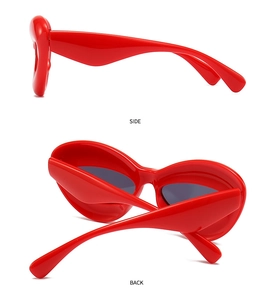 Side and back view of chunky red sunglasses with thick frames and dark grey lenses
