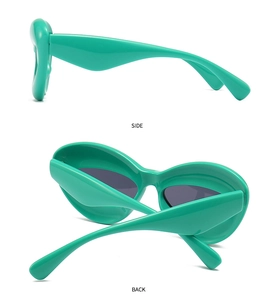 Detailed side and back view of green padded futuristic sunglasses with thick frames