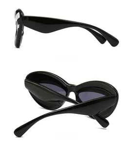 Side and back view of oversized futuristic sunglasses with black resin wrap frames
