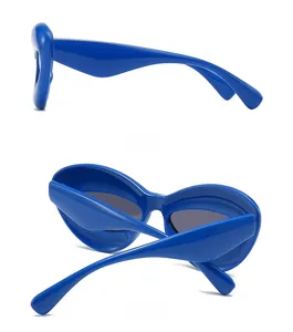 Side and back view of thick bright blue futuristic oversized square sunglasses