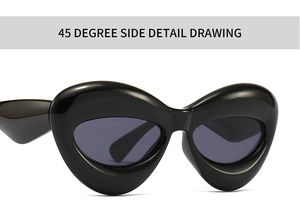 Close-up of futuristic thick frame sunglasses with glossy black resin 45-degree angle