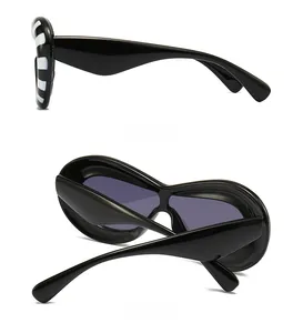 Detailed side and back views of futuristic black sunglasses with striped frame accents