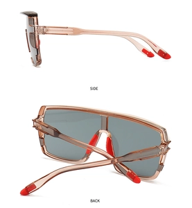 Side and back view of champagne oversized sunglasses with red rubber accents
