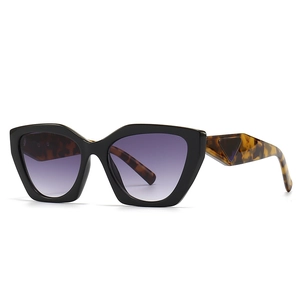 Retro square oversized sunglasses with black frames and tortoiseshell temples in purple tint