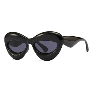 Futuristic polygon thick frame sunglasses with glossy black resin and deep grey lenses