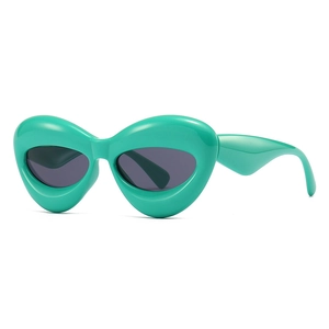 Futuristic oversized polygon sunglasses in mint green bubble frames with grey lenses