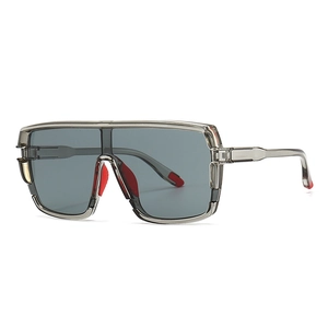 Oversized grey wraparound sports sunglasses with red non-slip padding details