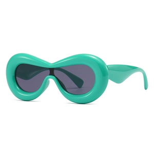 Futuristic polygon sunglasses with chunky mint green frame and dark grey lenses