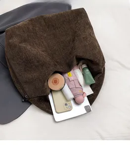 Top view of large capacity dark brown tote bag showing spacious interior with daily items