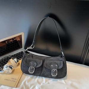 Chic black denim shoulder bag with silver buckle pockets in a retro Y2K fashion style