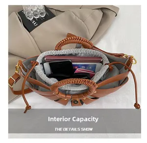 Detailed interior view of a brown woven handle tote bag showing spacious storage capacity