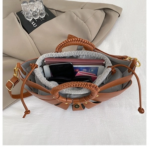 Detailed top view of the woven bag interior with drawstring lining and daily essentials