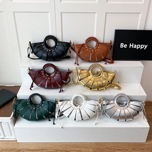 Handcrafted woven basket handbag with round handles in seven colors including black and burgundy