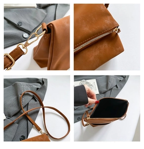 Detailed views of brown leather bag with gold hooks, zipper, strap, and spacious interior