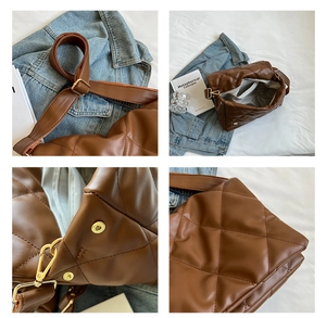 Detail of brown quilted bag showing gold hardware adjustment and spacious interior