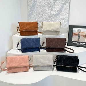 Minimalist faux suede crossbody bags set with gold zippers in seven different colors