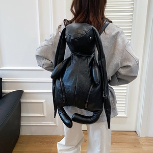 Unique black bunny-shaped leather backpack with long ears and multiple zipper pockets