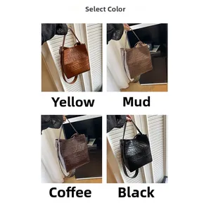 Selection of crocodile embossed bucket bags in yellow, mud, coffee, and black tones