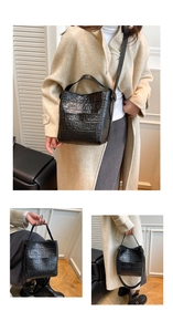 Close-up of black crocodile-embossed texture on minimalist bucket bag for women