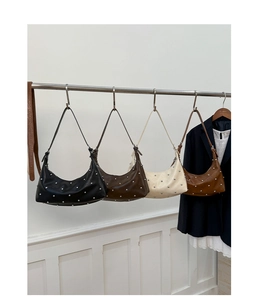 Detailed display of studded hobo shoulder bags in black, coffee, cream and brown