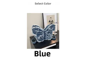 Detailed close-up of blue denim butterfly-shaped shoulder bag with distressed frayed edges