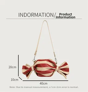 Detailed view of candy-shaped striped crossbody bag with dimensions and ribbon-like ends