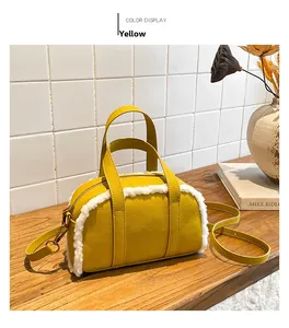 Yellow faux fur bowling bag on wooden table with elegant minimalist home decor