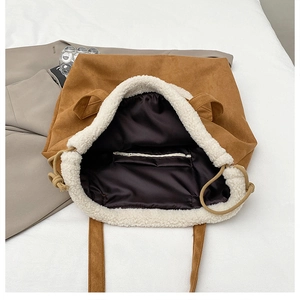 Interior view of large faux suede tote bag with lamb wool trim and zipper pocket